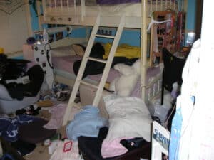 Purpose: To visually represent the idea of "stuffing emotions" and how they can eventually spill out if not dealt with.
Image of a cluttered room symbolizing unprocessed emotions – source: Morguefile anda2007
